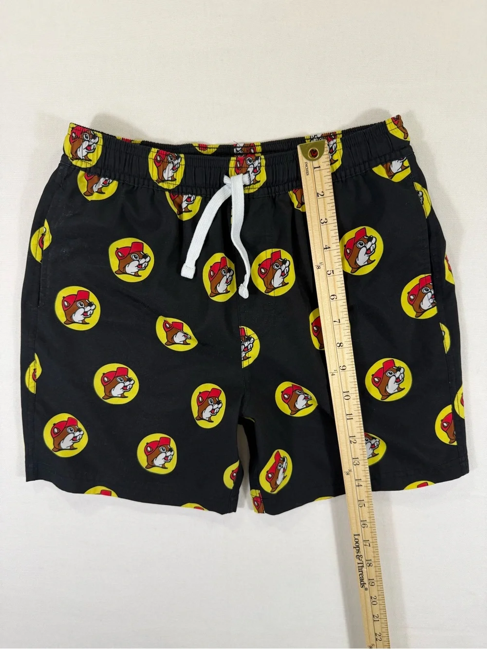 Kids Black Graphic Swim Shorts with Yellow & Red Badge Print